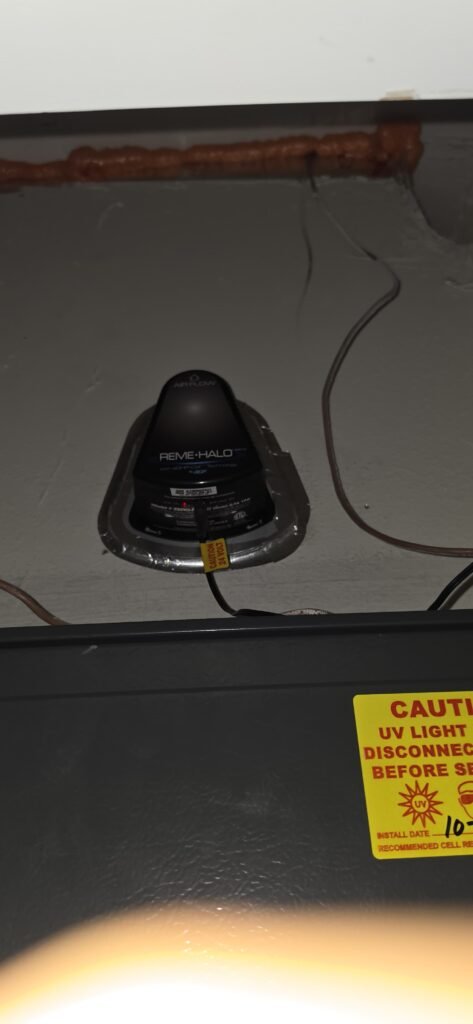 A REME HALO unit installed on the ductwork of an air handler in Riverview, FL 33579.