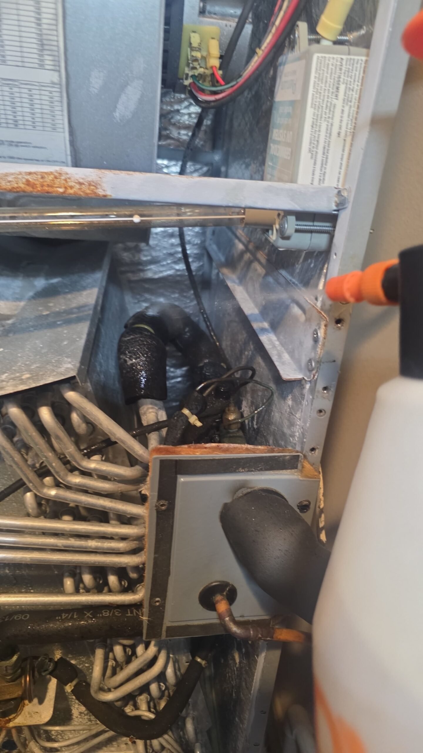 Close-up of HVAC components being serviced during Elite Therapy Plan in Bradenton, FL 34202.