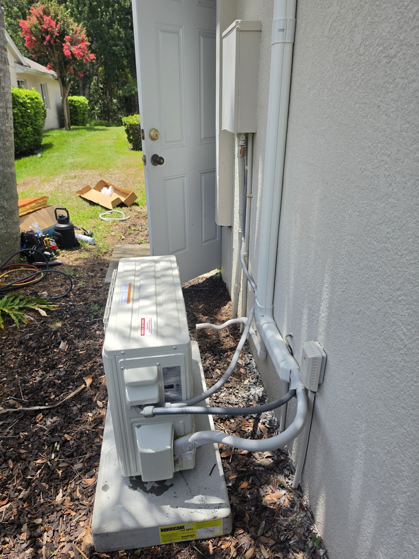 Side view of installed mini split AC outdoor unit, Lutz, FL 33558.
