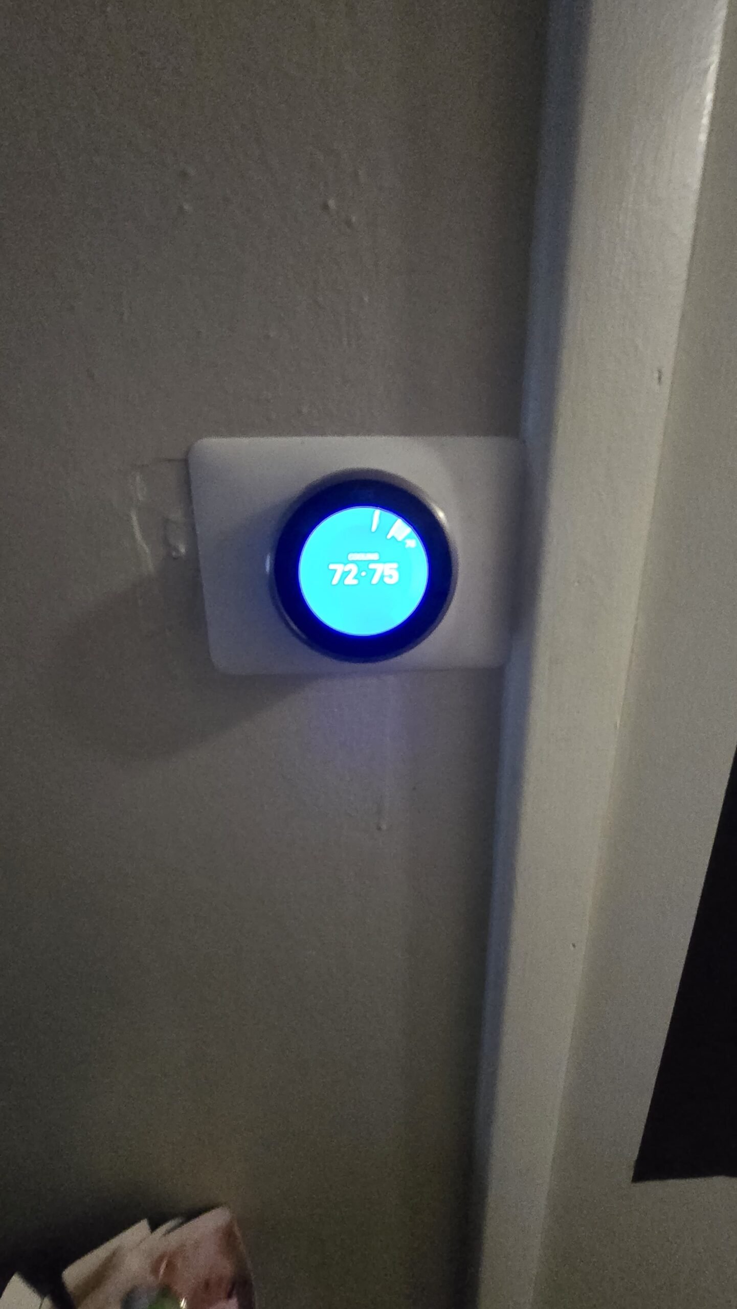 Smart thermostat showing settings in Tampa, FL 33613 home.