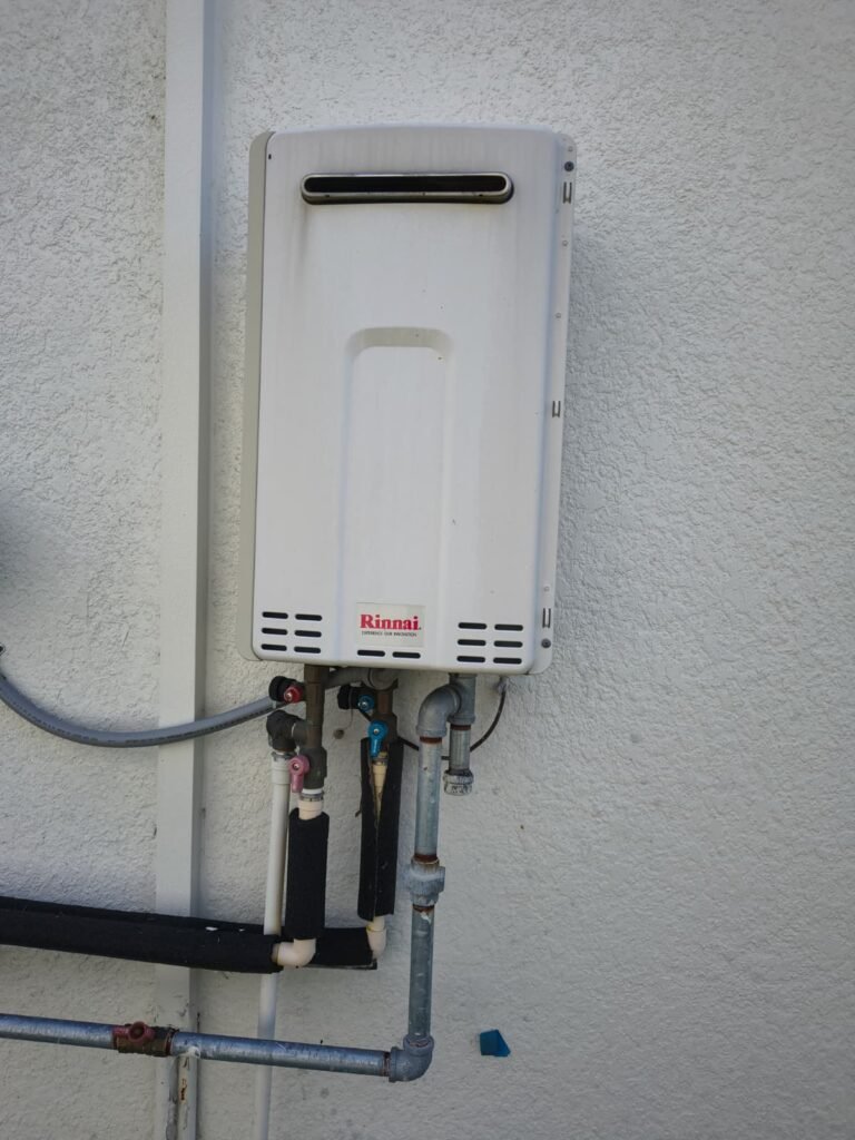 A tankless water heater after plumbing maintenance in Land O’ Lakes, FL 34637.