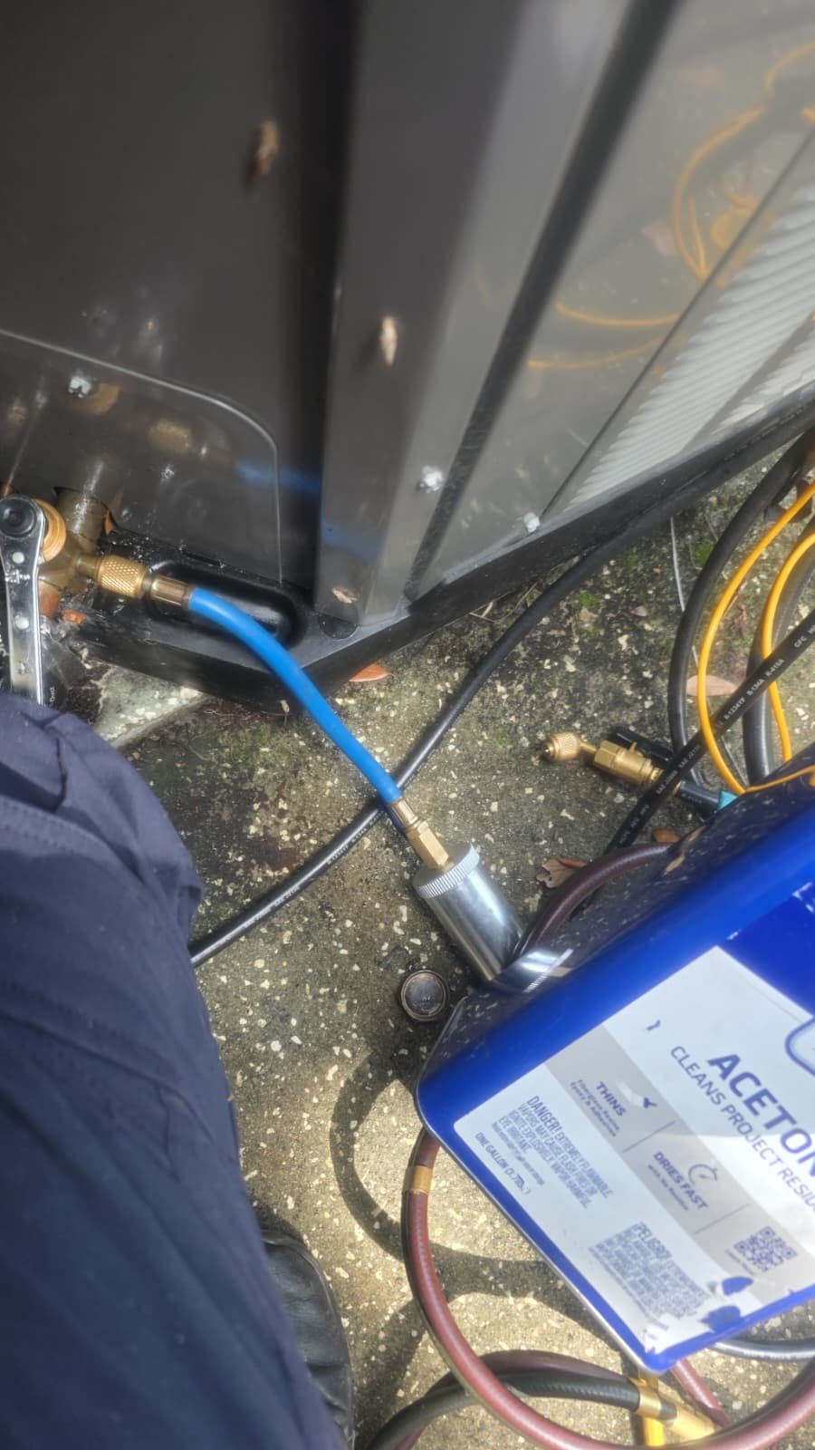 Technician at Work - New Port Richey, FL 34655 Technician working on AC unit with acetone and tools in New Port Richey, FL 34655.