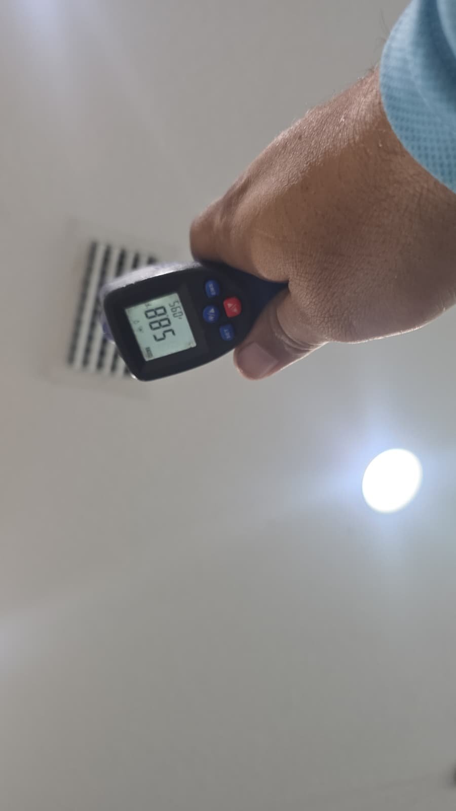 Ceiling Vent Check - Tampa, FL 33611 Temperature gun aimed at ceiling vent during HVAC work, Tampa, FL 33611.