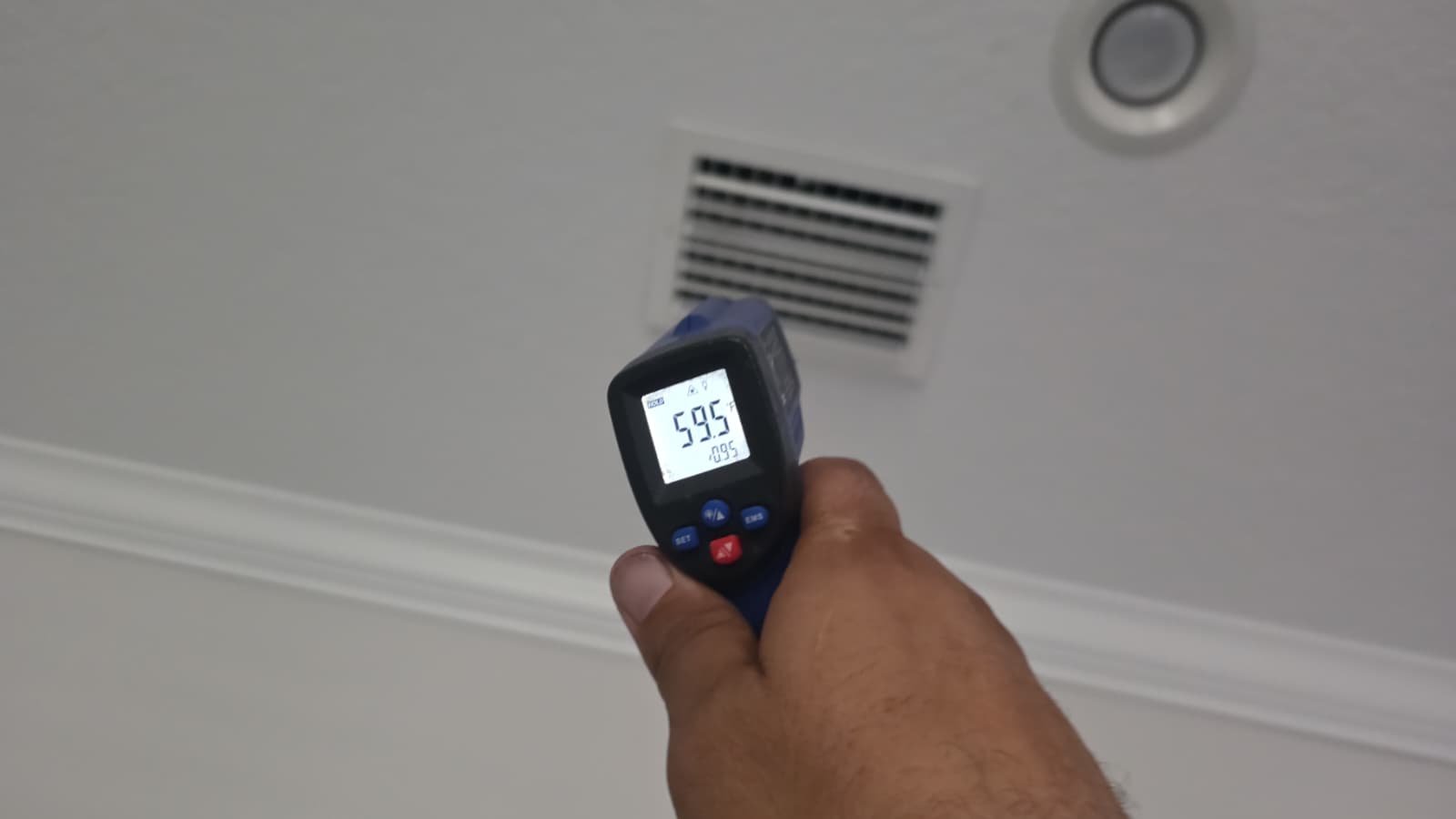 Ceiling Vent Temperature - Tampa, FL 33611 Temperature gun aimed at ceiling vent with reading, Tampa, FL 33611.
