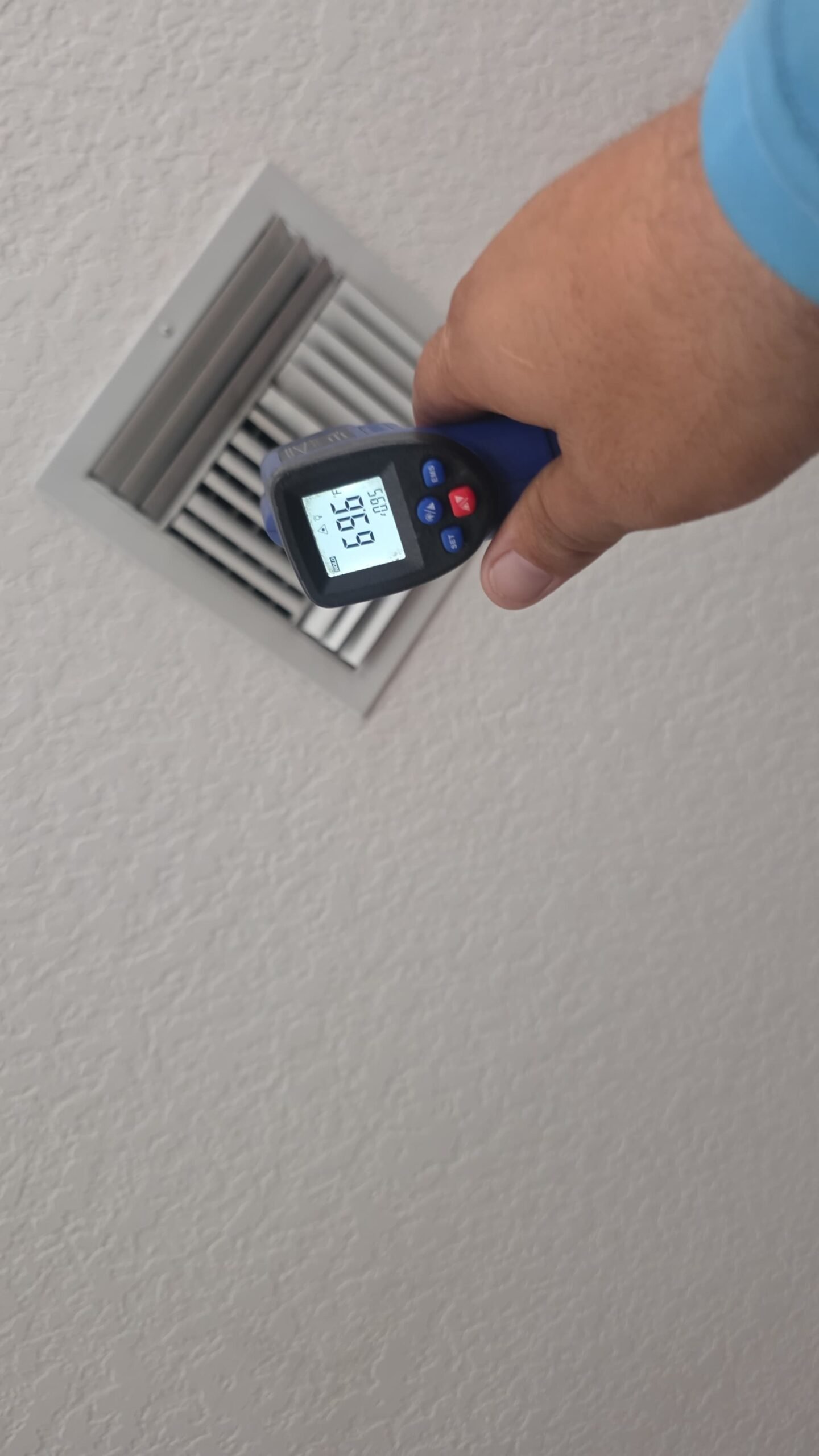 Thermometer measuring air vent temperature during Elite Therapy Plan in Bradenton, FL 34202.