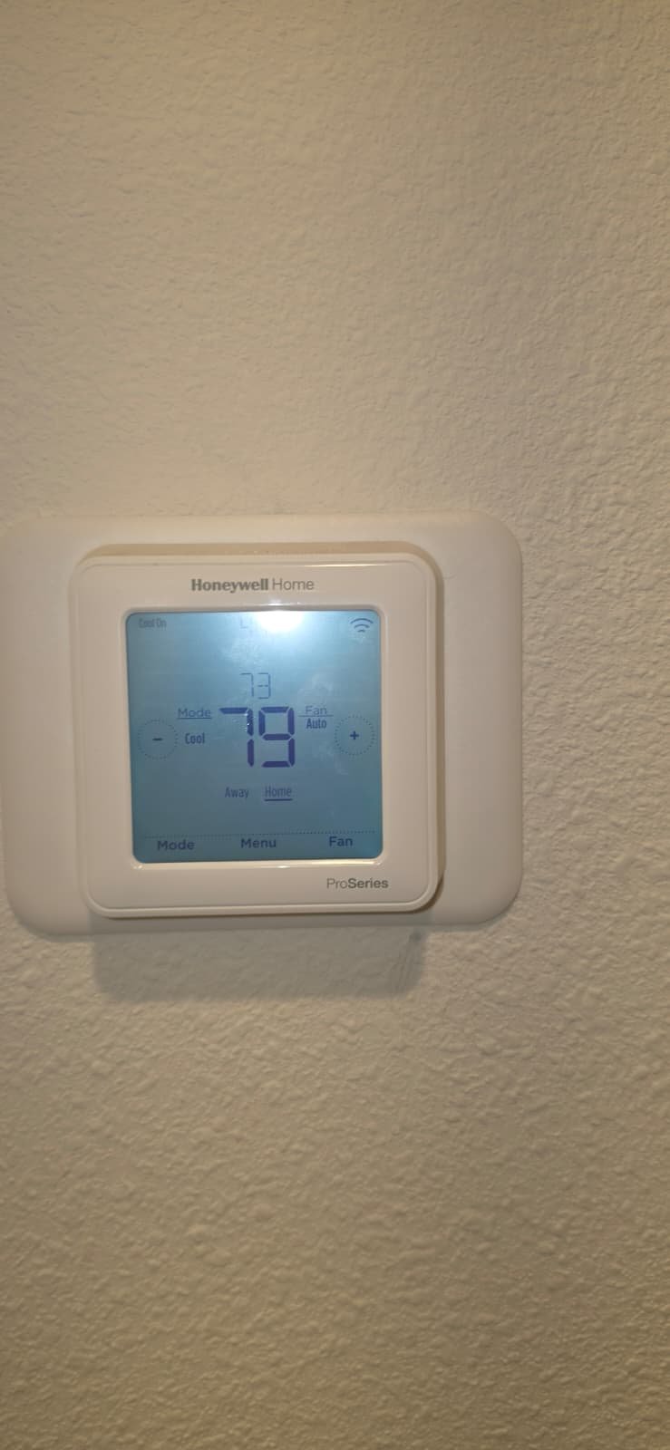 Digital thermostat displaying temperature settings in Odessa, FL 33556. Efficient climate control.