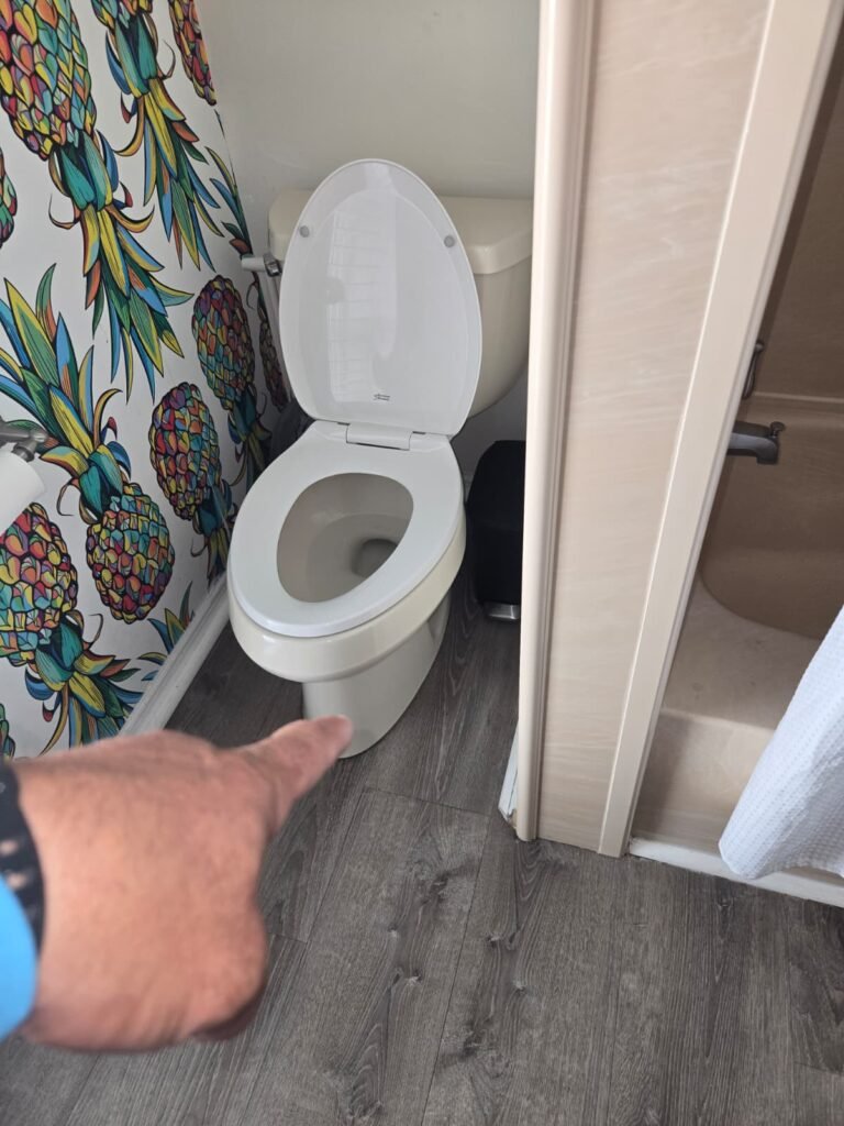 Toilet Inspection in Progress in Seminole, FL 33776 Person pointing at toilet in bathroom, Seminole, FL 33776