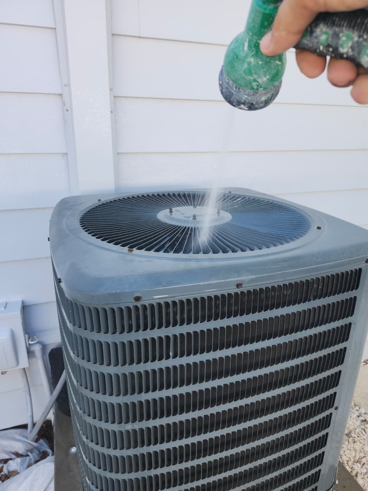 Top of outdoor AC unit cleaned with water, St. Petersburg, FL 33703.