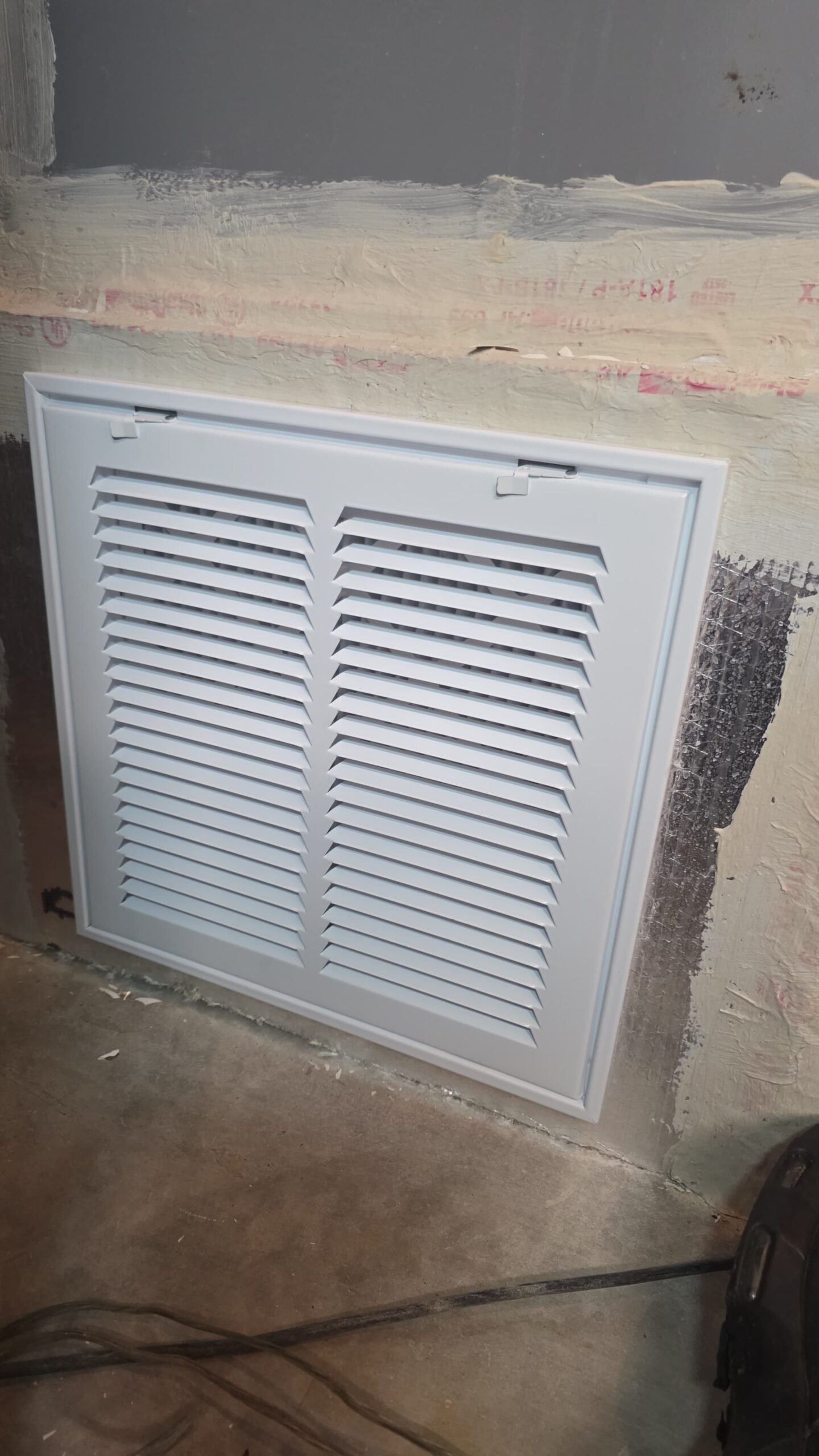 Installed vent cover on a wall, Tampa, FL 33606.