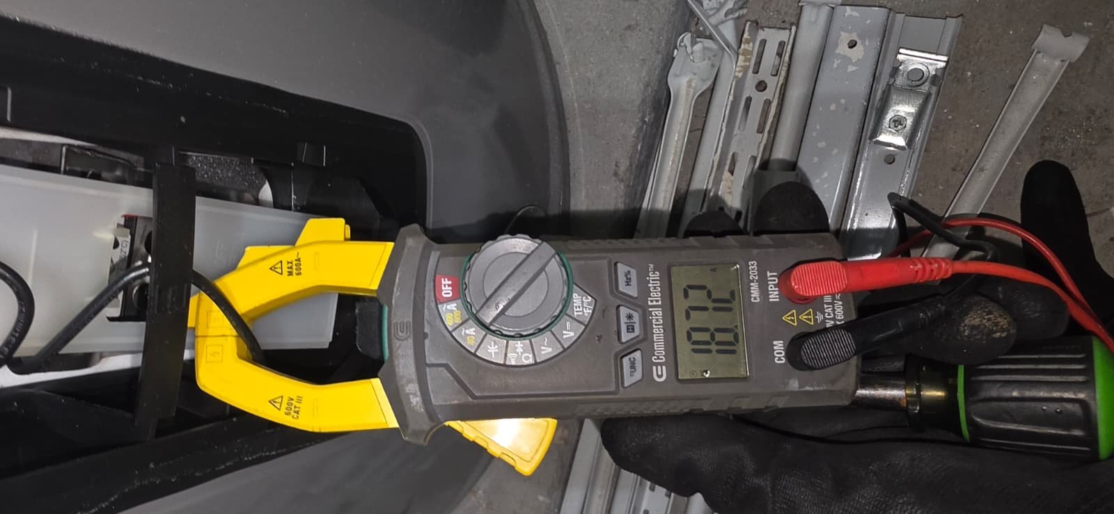 Voltage Measurement - Tampa, FL 33624 Side view of multimeter measuring voltage on water heater in Tampa, FL 33624.