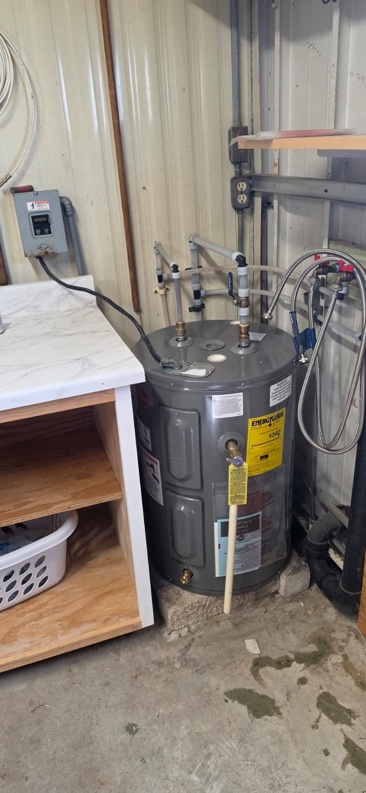 Newly installed water heater in utility room, Port Richey, FL 34668. Efficient plumbing solutions.