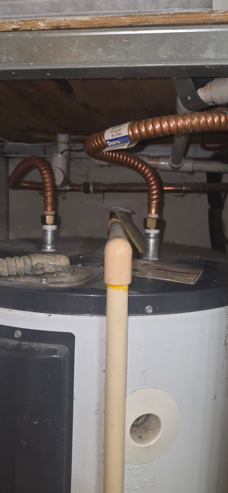 Water Heater Installation Progress in Tampa, FL 33615 Pipes and connections above water heater in Tampa, FL 33615. In-progress installation.
