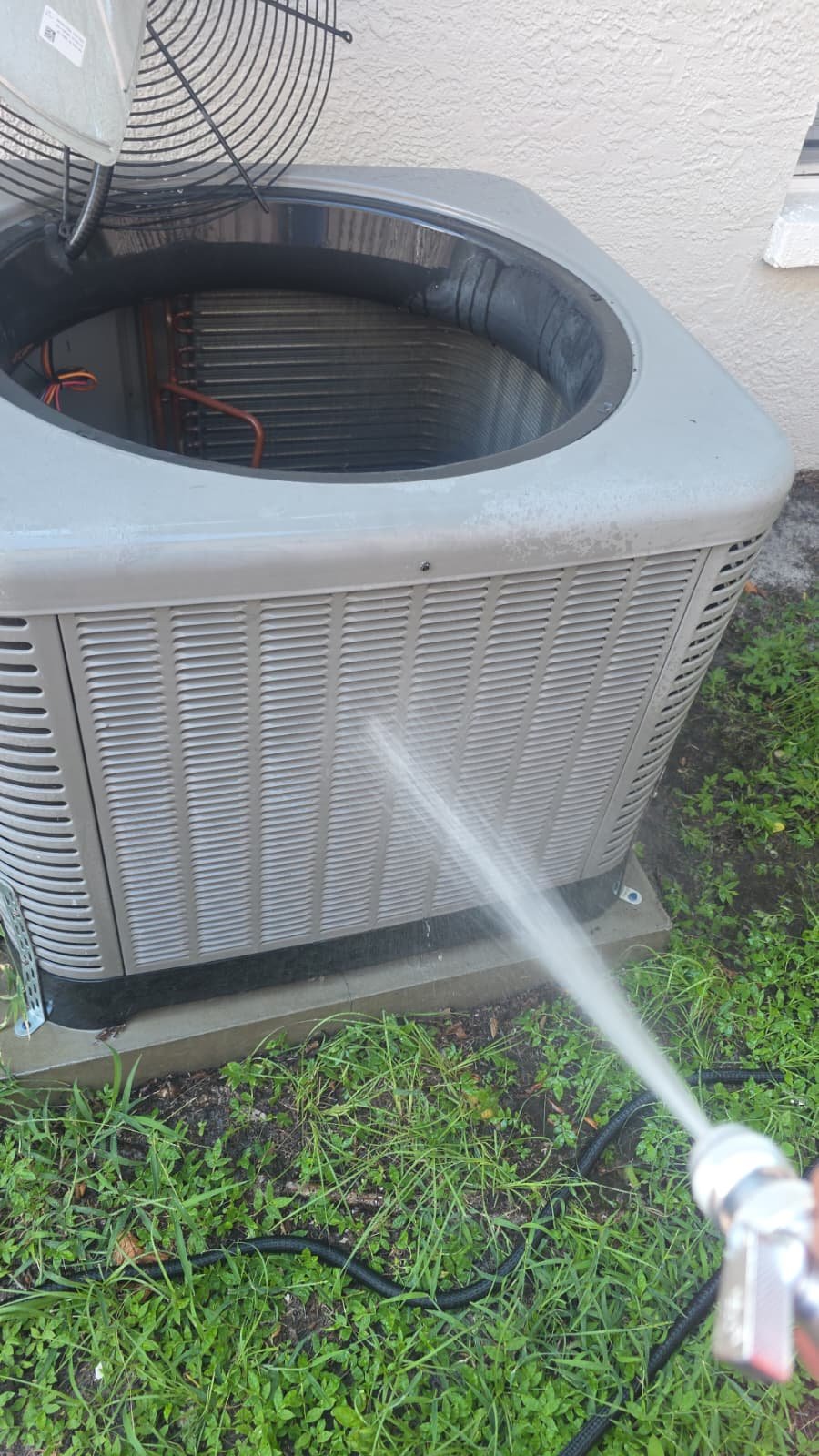 Water Spray Cleaning Condenser - Tampa, FL 33607 Condenser unit being cleaned with water spray in Tampa, FL 33607.