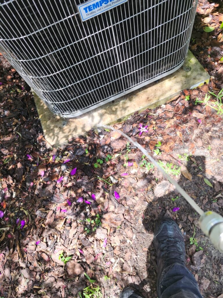 Cleaning Base of AC Unit in Tampa, FL 33625 Base of AC unit being cleaned in Tampa, FL 33625