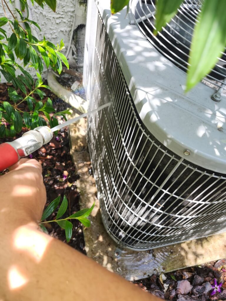 AC Unit Cleaning in Progress in Tampa, FL 33625 AC unit cleaning during maintenance in Tampa, FL 33625