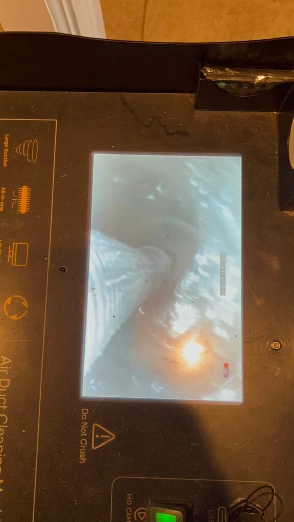 The camera screen on our duct cleaning machine showing the inside of a duct in Tampa, FL 33611.