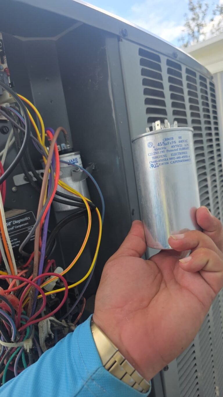 Technician replacing capacitor in AC unit, Brandon, FL 33511