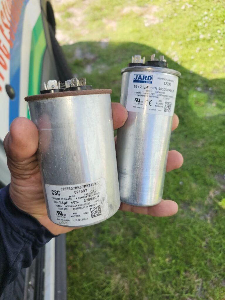 An old and a new capacitor side by side in Tampa, FL 33605.