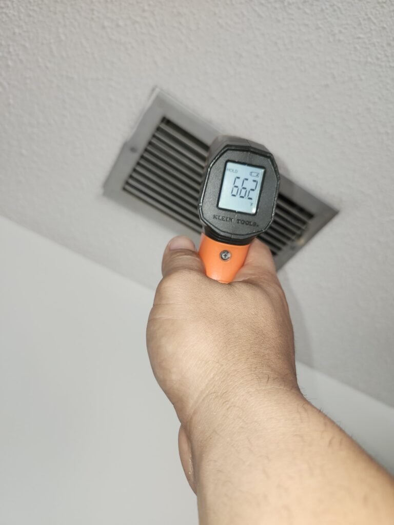 Checking temperature at air vent, Hudson, FL 34667