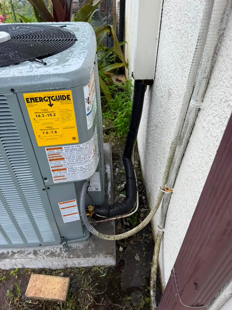 The yellow EnergyGuide label on an outdoor AC unit in Odessa, FL 33556.