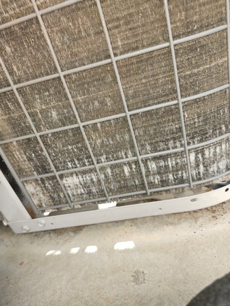 Dirty condenser coil before cleaning in Hudson, FL 34667