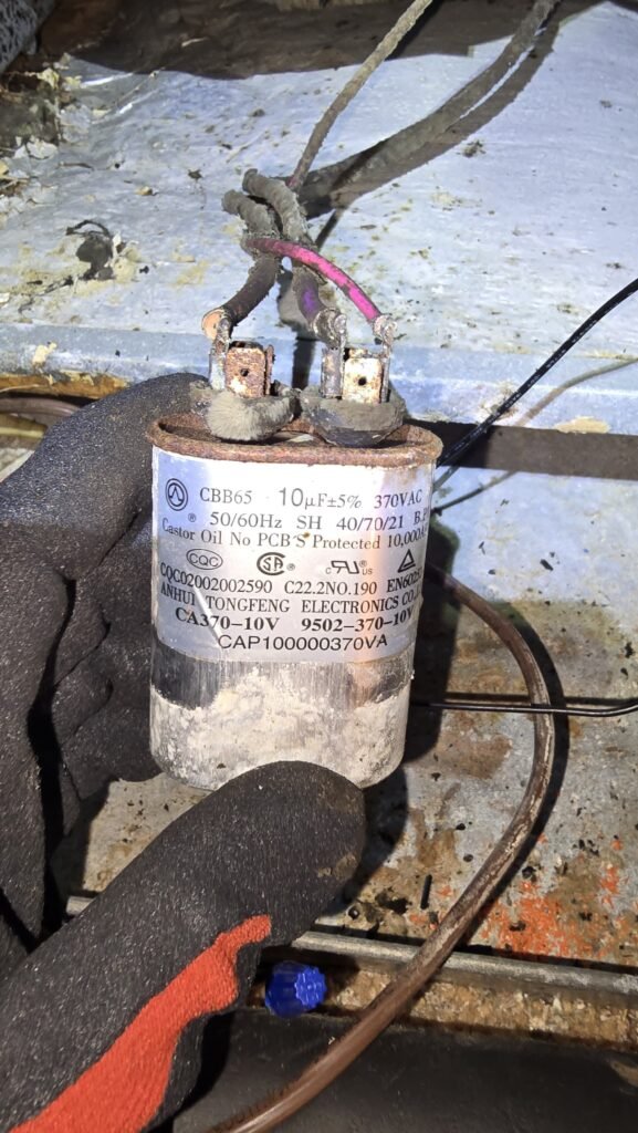 A worn run capacitor inside an outdoor AC unit in St. Petersburg, FL 33705.