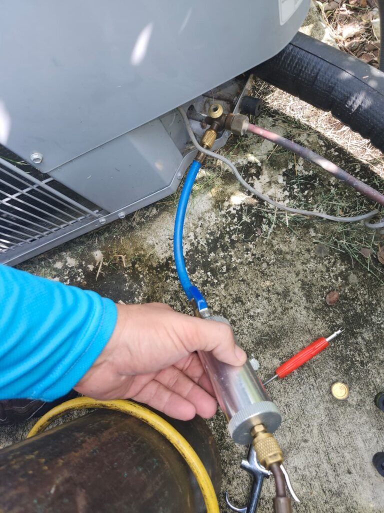 Technician Using Tool on HVAC Unit in Tampa, FL 33647 Technician using tool on HVAC unit, Tampa, FL 33647