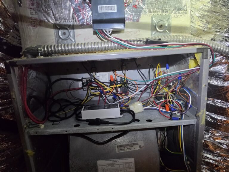 HVAC Panel Wiring During Installation in Tampa, FL 33615 Open HVAC panel with wiring during air purifier installation in Tampa, FL 33615