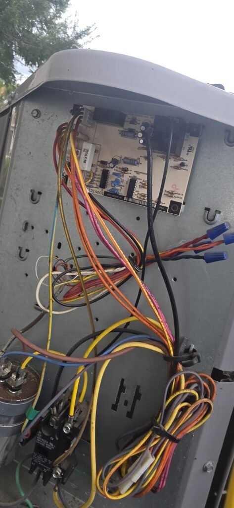 An outdoor unit opened up to check the control board and wiring in Wesley Chapel, FL 33543.