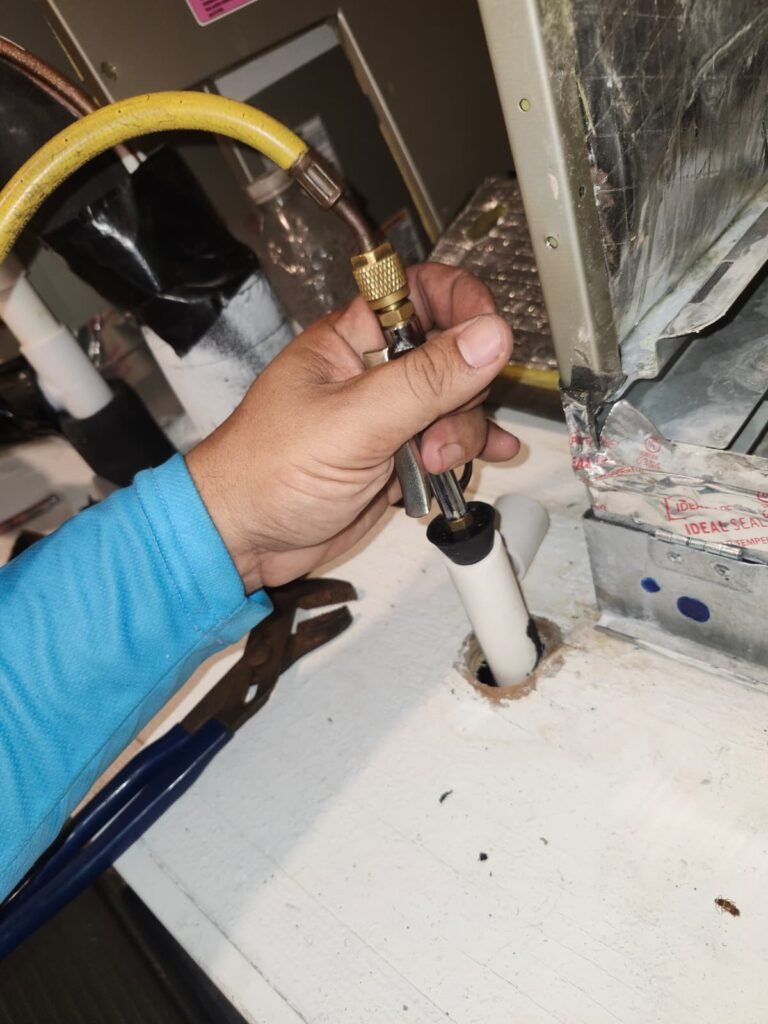 Technician Working on HVAC in Tampa, FL 33647 Technician working on HVAC pipe connection, Tampa, FL 33647
