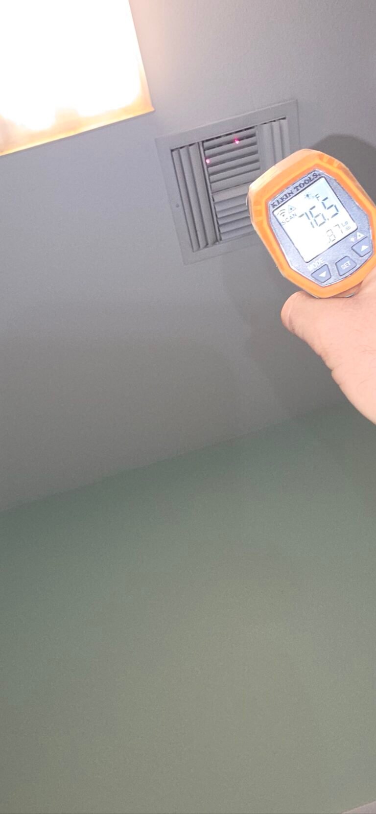 Infrared Thermometer at Ceiling Vent, Tampa, FL 33605 Infrared thermometer pointed at ceiling vent, Tampa, FL 33605