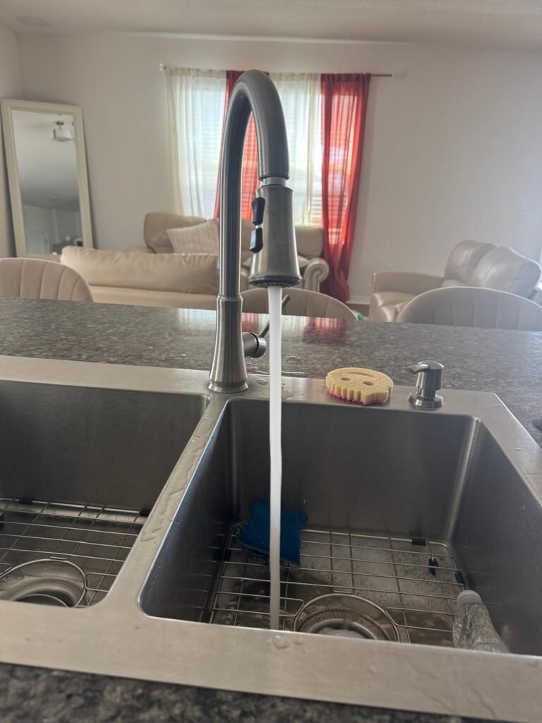 Kitchen sink with running water in Wesley Chapel, FL 33545