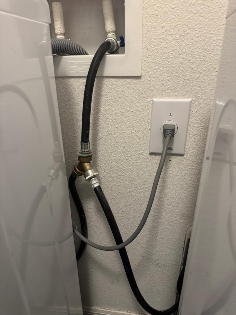 Laundry area with water hoses in Wesley Chapel, FL 33545