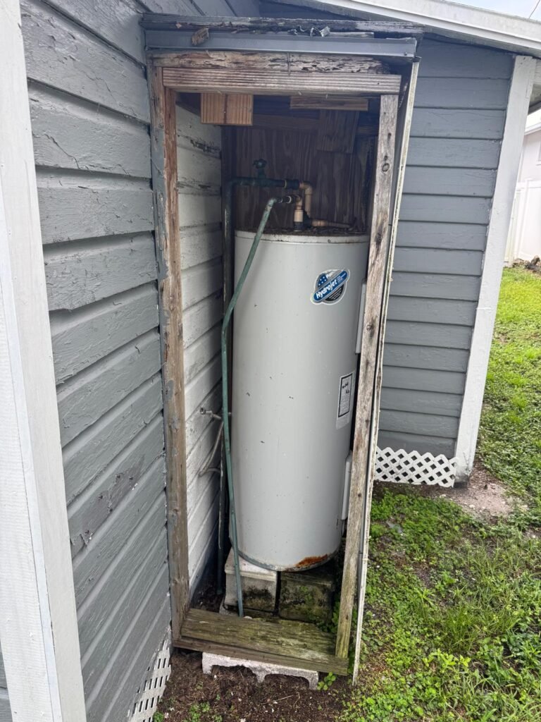 Old water heater in narrow enclosure, St. Petersburg, FL 33704