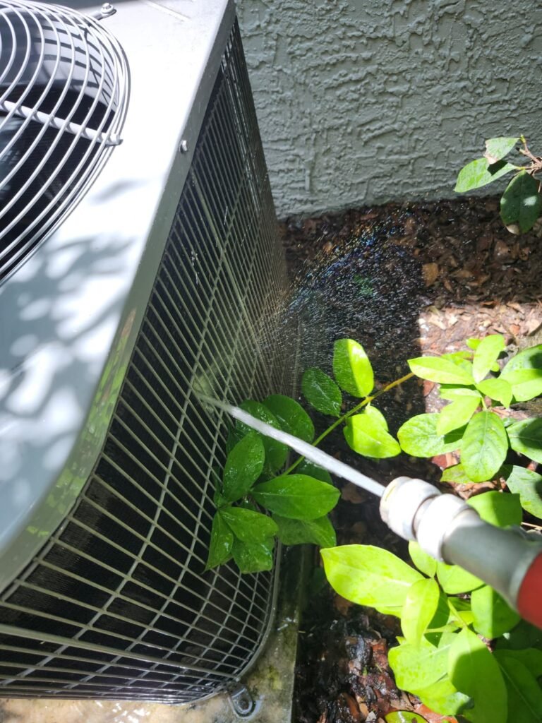 Outdoor AC Unit Cleaning in Tampa, FL 33625 Outdoor AC unit being cleaned in Tampa, FL 33625