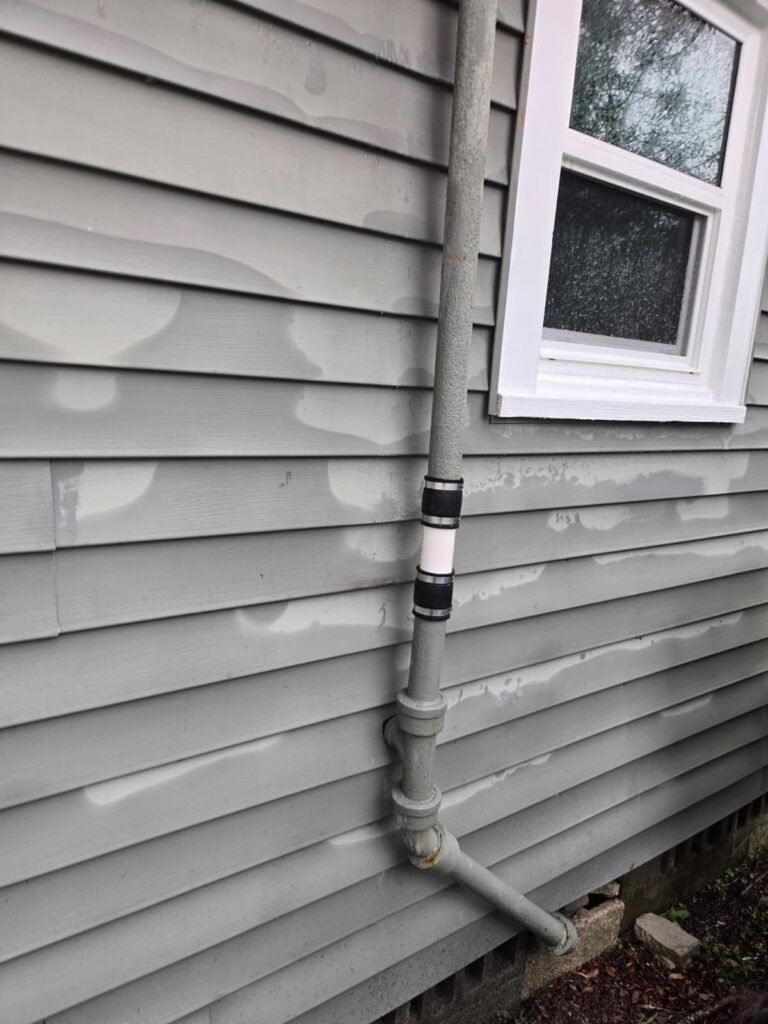 Repaired plumbing vent pipe on house exterior, Tampa, FL 33612
