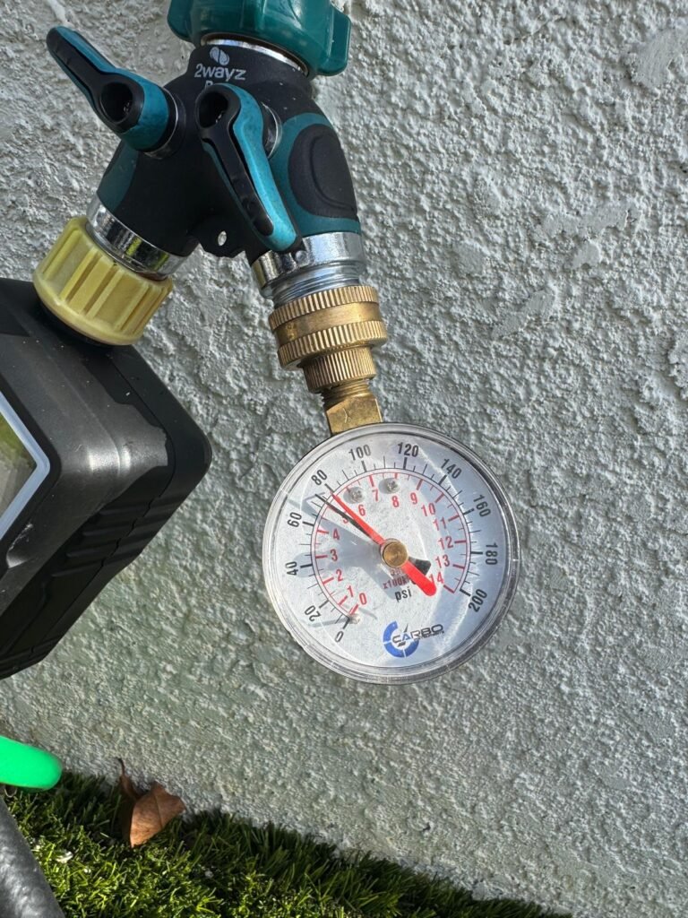 Checking water pressure with a gauge on a hose bib in Land O’ Lakes, FL 34637.