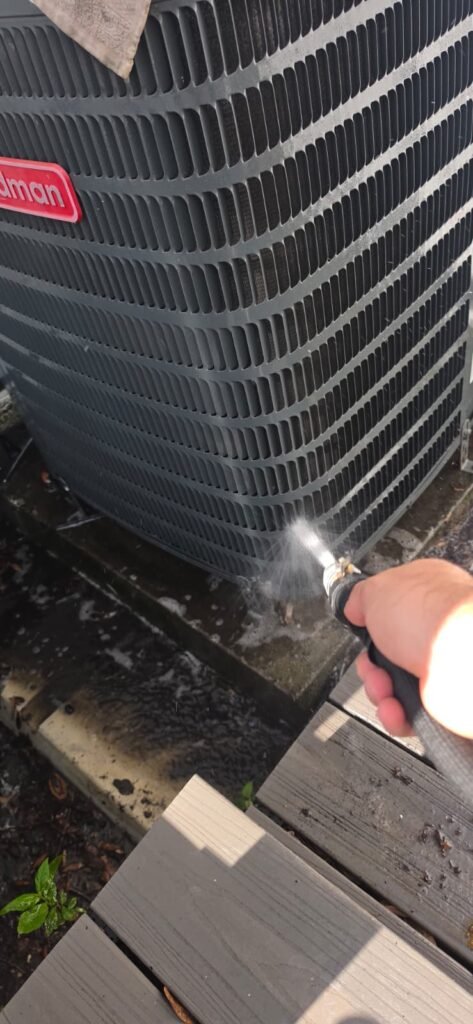 Spraying Water on AC Unit, Tampa, FL 33605 Technician spraying water on AC unit, Tampa, FL 33605