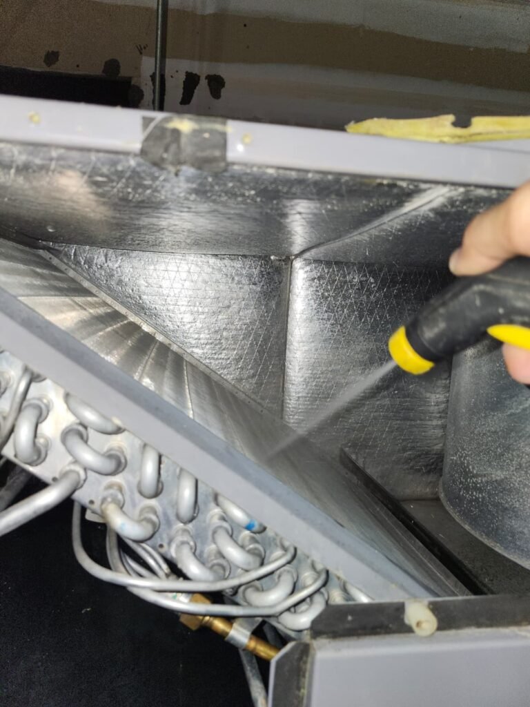 Technician Cleaning Inside HVAC Unit in St. Petersburg, FL 33711 Technician cleaning inside HVAC unit in St. Petersburg, FL 33711