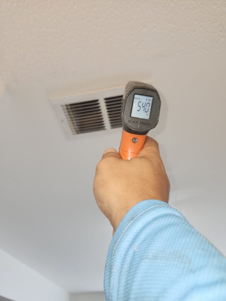 Temperature check near ceiling vent in Tampa, FL 33624