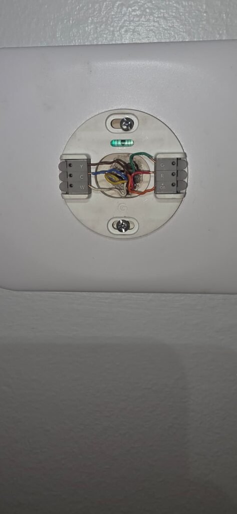 A thermostat base with its low-voltage wires connected in Brandon, FL 33511.