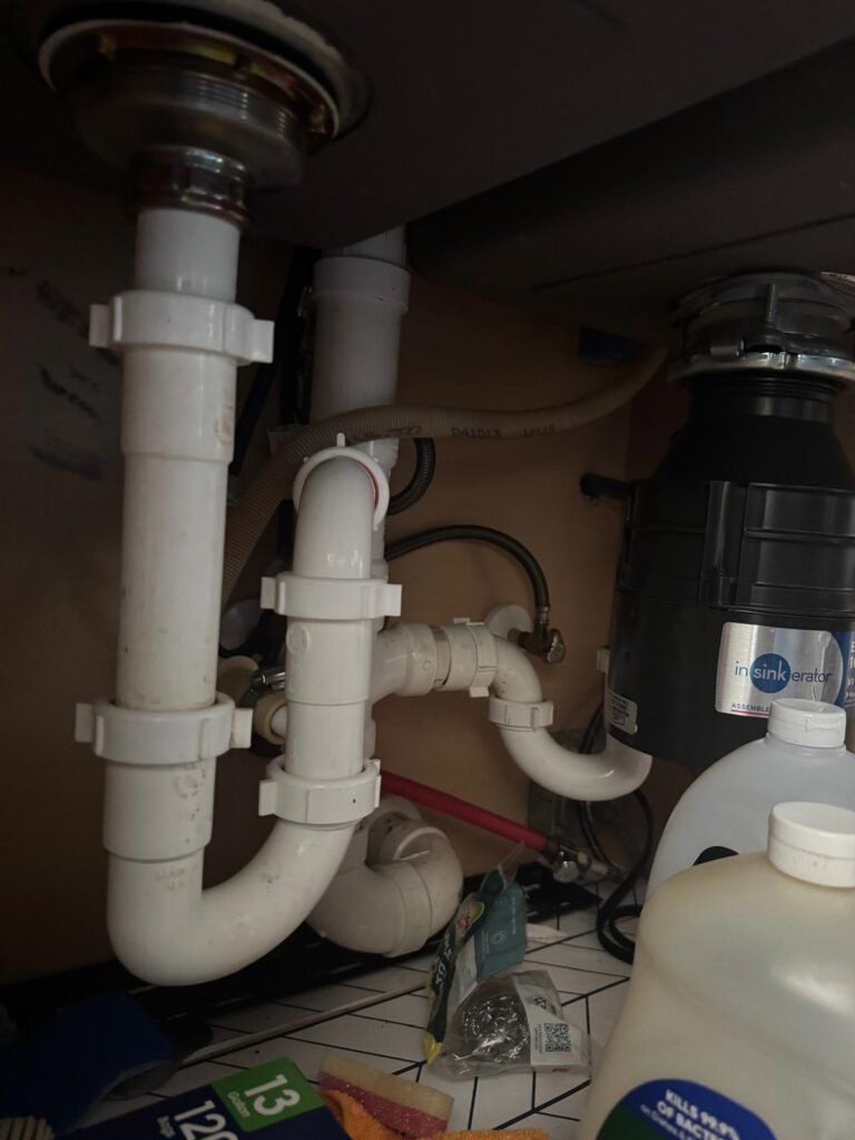 Under-sink plumbing with garbage disposal in Wesley Chapel, FL 33545