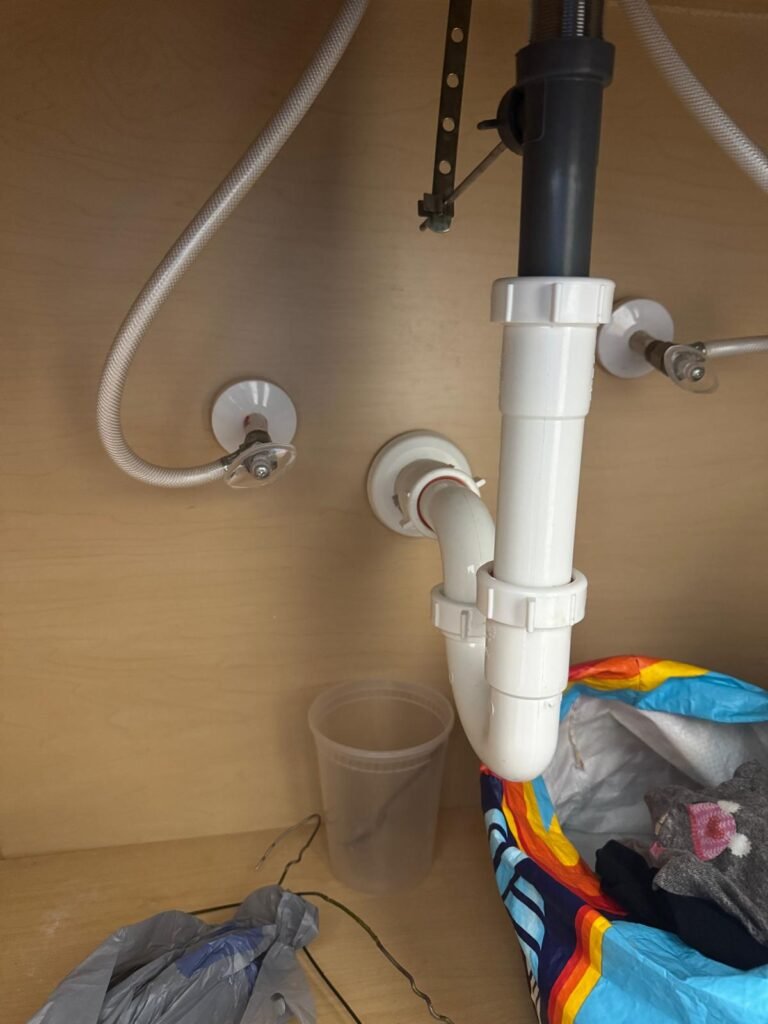 Under-sink plumbing with pipes in Wesley Chapel, FL 33545