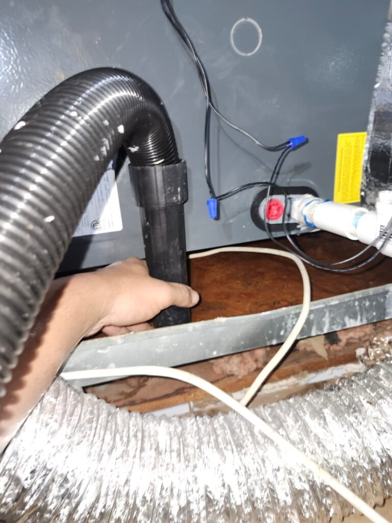 Vacuuming Near HVAC Unit in Clearwater, FL 33765 Vacuuming near HVAC unit in attic, Clearwater, FL 33765