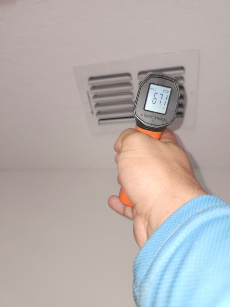 Vent Temperature Measurement in Lutz, FL 33558 Technician measuring vent temperature in Lutz, FL 33558