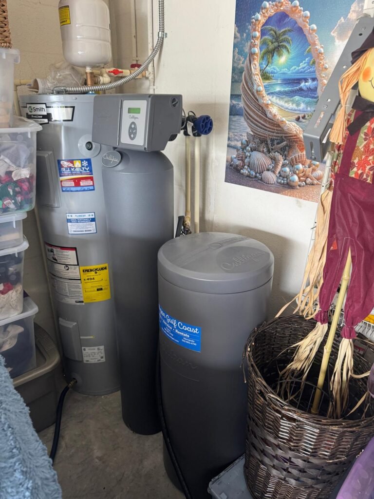 A softener and brine tank installed next to a water heater in Trinity, FL 34655.