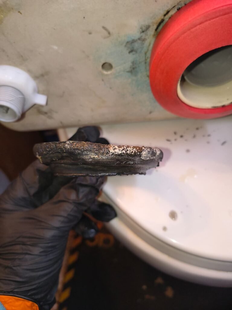 Worn Gasket Detail Near Toilet Tank, Tampa, FL 33614 Close-up of worn gasket near toilet tank, Tampa, FL 33614
