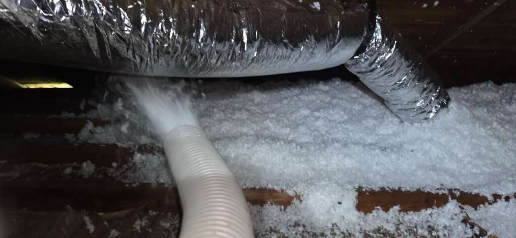Insulation being blown into an attic around the ductwork in St. Petersburg, FL 33705.