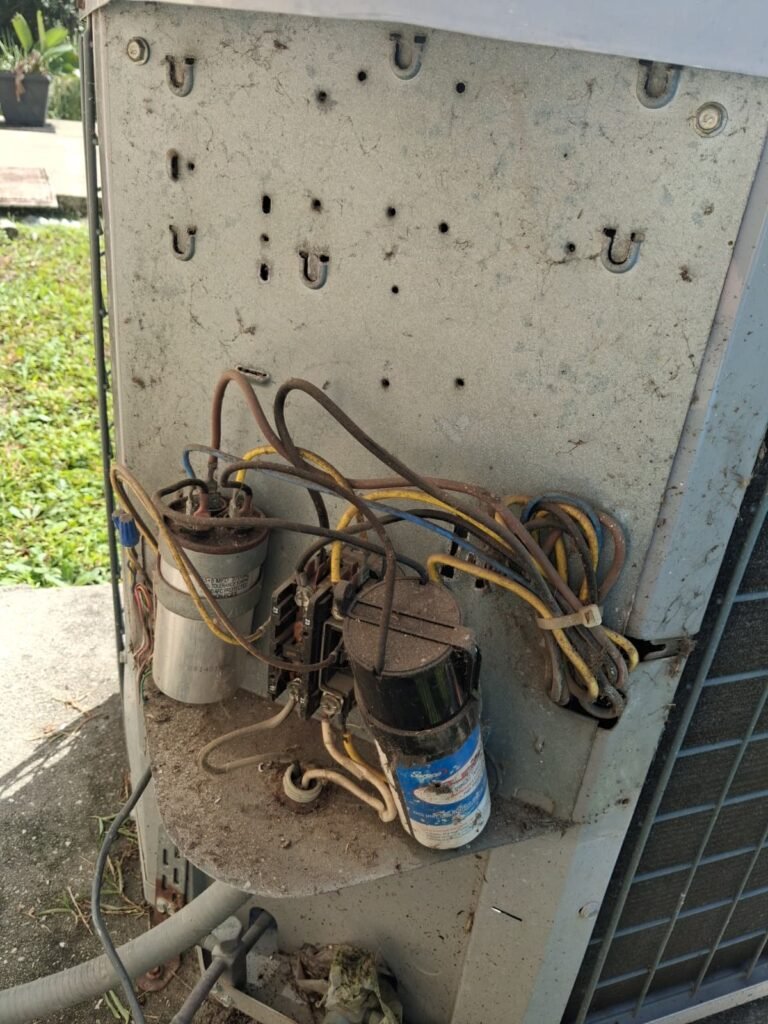 Capacitors and wiring inside a condenser’s control panel in Riverview, FL 33578.