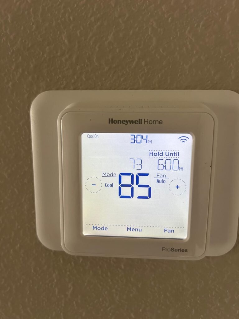 Digital thermostat showing temperature in Riverview, FL 33579